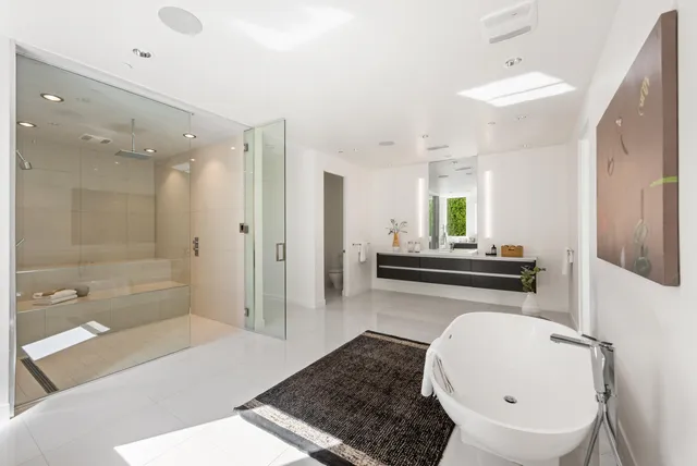 a bathroom with a bathtub and a shower