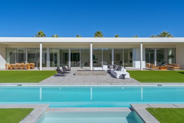 a view of a swimming pool with a patio