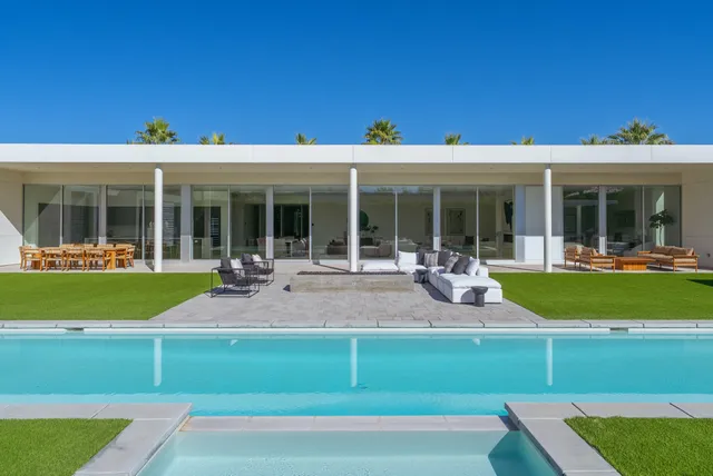 a view of a swimming pool with a patio