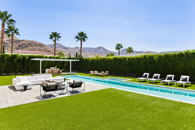 a view of swimming pool with lounge chair