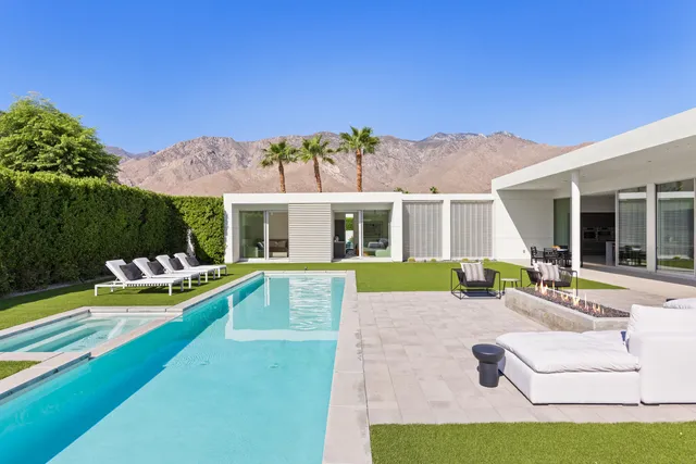 a view of a house with pool table and chairs
