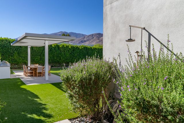 a view of swimming pool with outdoor seating