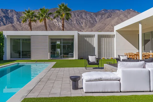 a view of wooden fence and a couple of houses