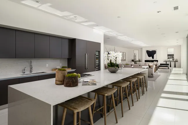 a kitchen with lots of counter top space and living room