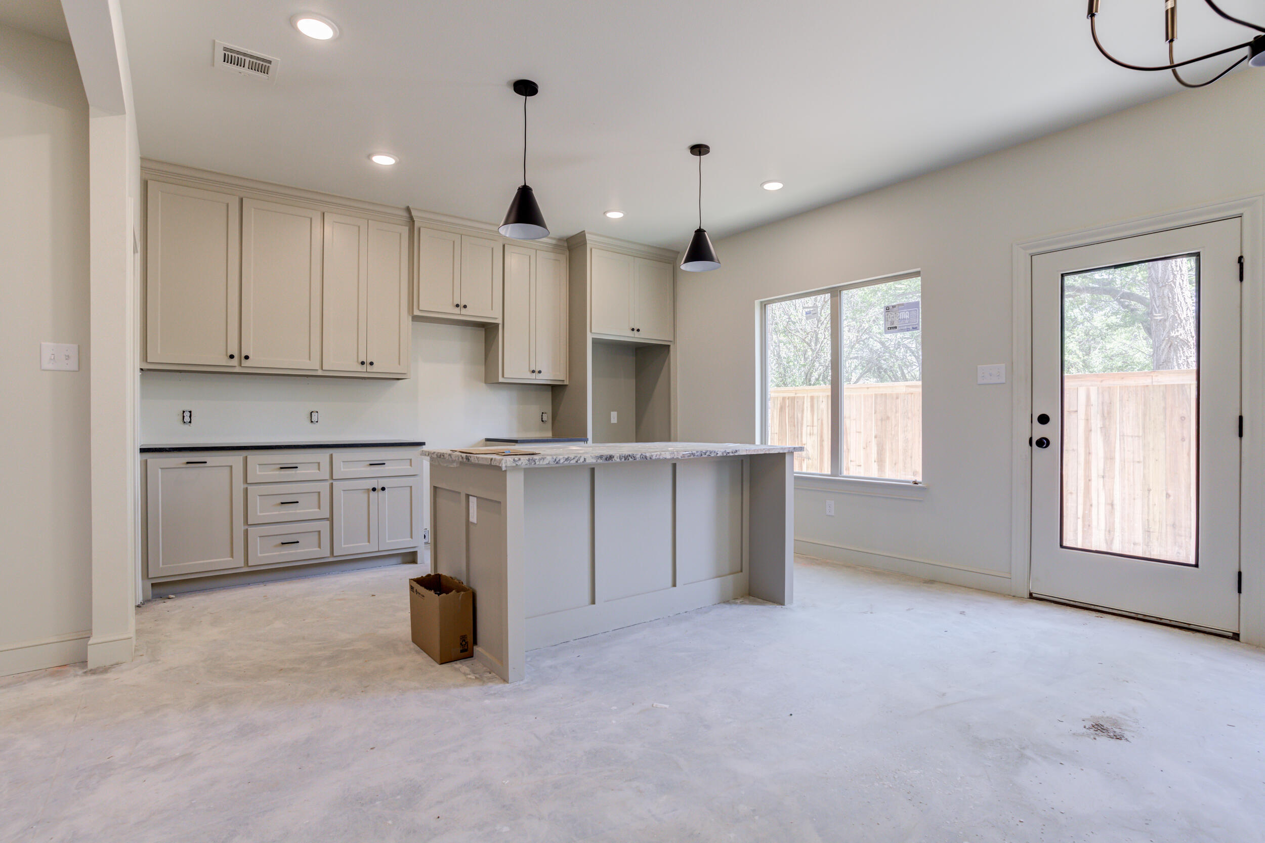 3425 24th Street Lubbock, TX 79410 - Photo 15 of 45 a kitchen with cabinets and window