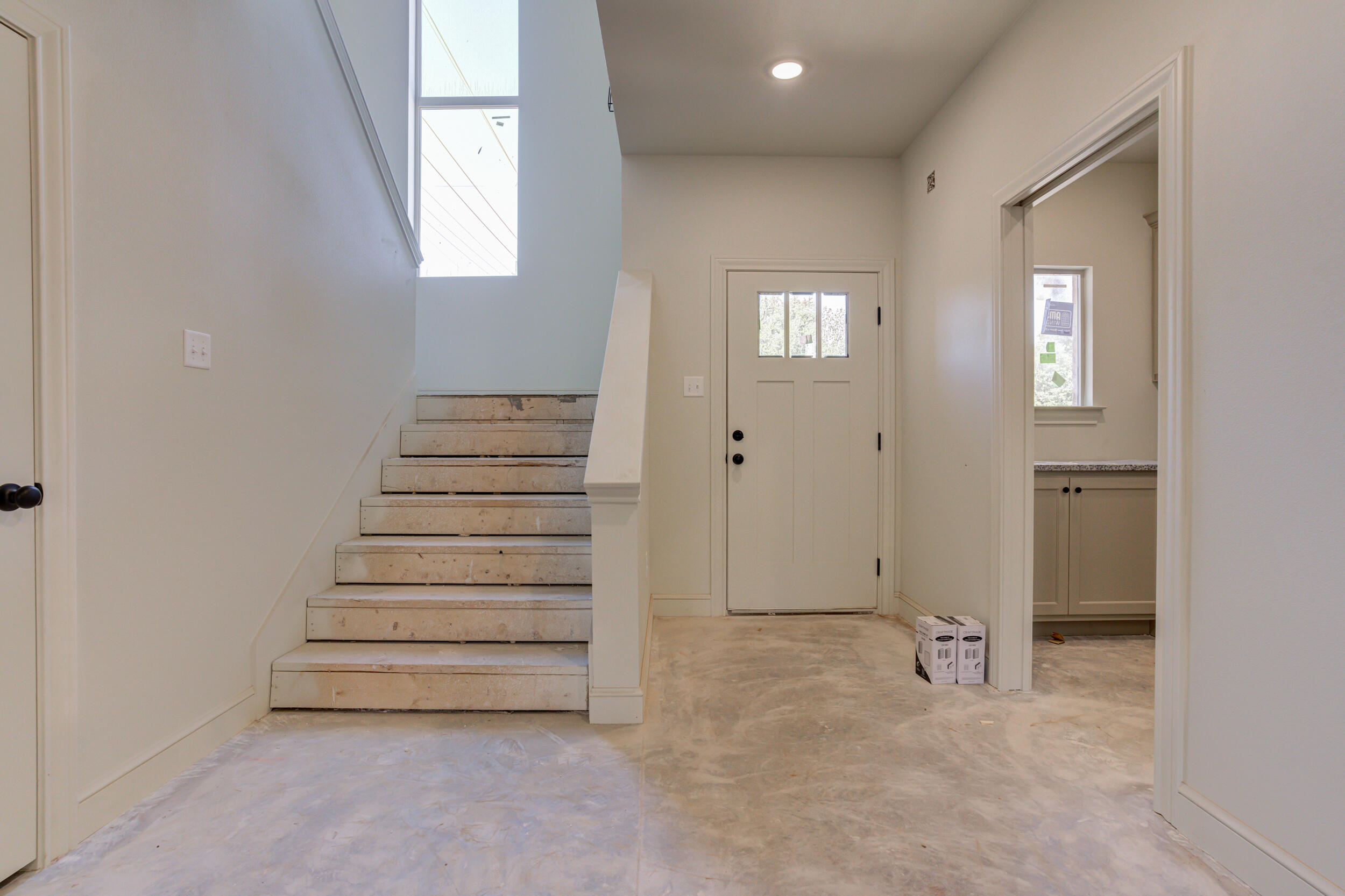 3425 24th Street Lubbock, TX 79410 - Photo 8 of 45 a view of room with stairs and a window