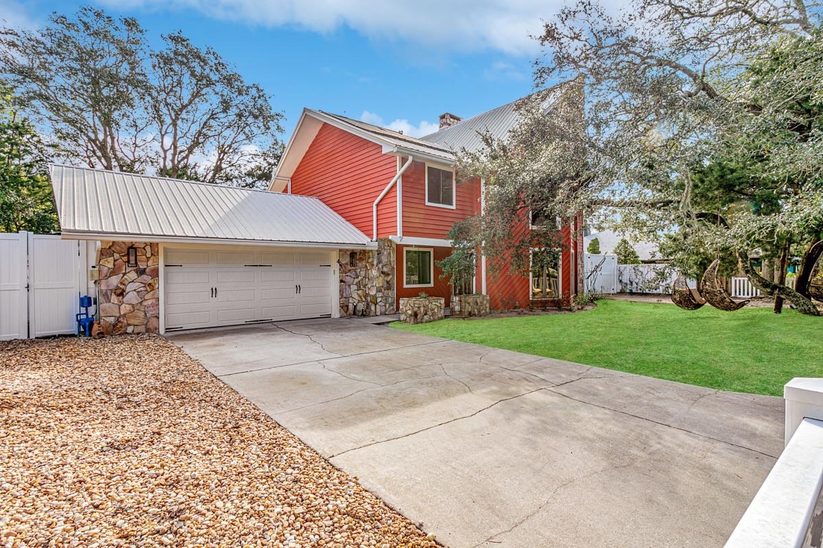 4 Santa Maria Lane St. Augustine, FL 32080 - Photo 2 of 35 front view of a house with a yard and a garage