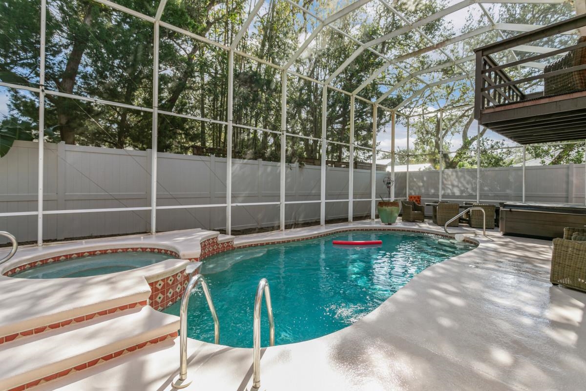 4 Santa Maria Lane St. Augustine, FL 32080 - Photo 29 of 35 a view of swimming pool with chairs and wooden fence