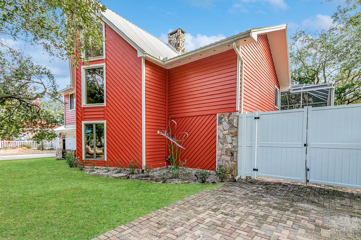 4 Santa Maria Lane St. Augustine, FL 32080 - Photo 3 of 35 a front view of a house with garden