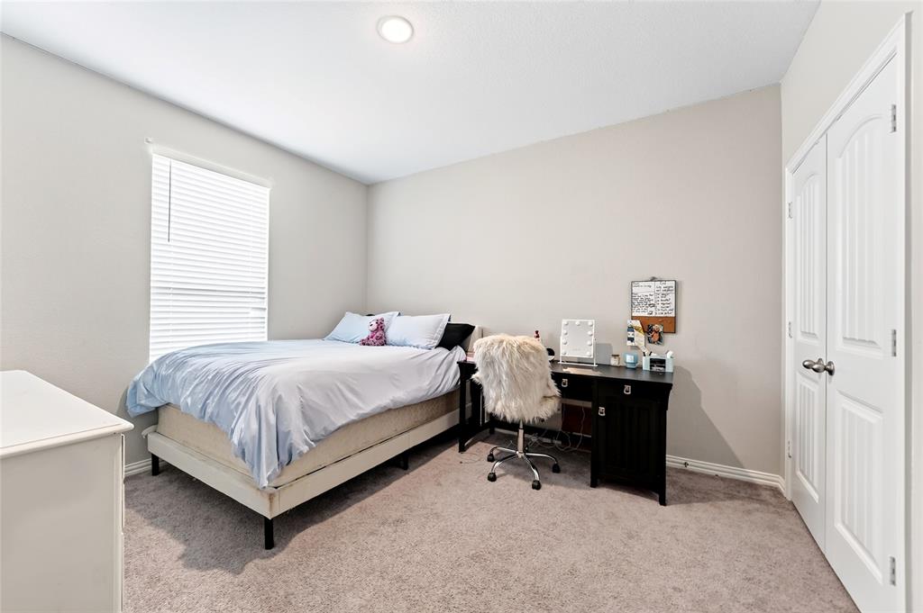 113 Ridgetop Trail Rhome, TX 76078 - Photo 18 of 32 Recessed ceiling lighting, neutral wall paint, carpet flooring, window with blinds, and bi-fold closet doors