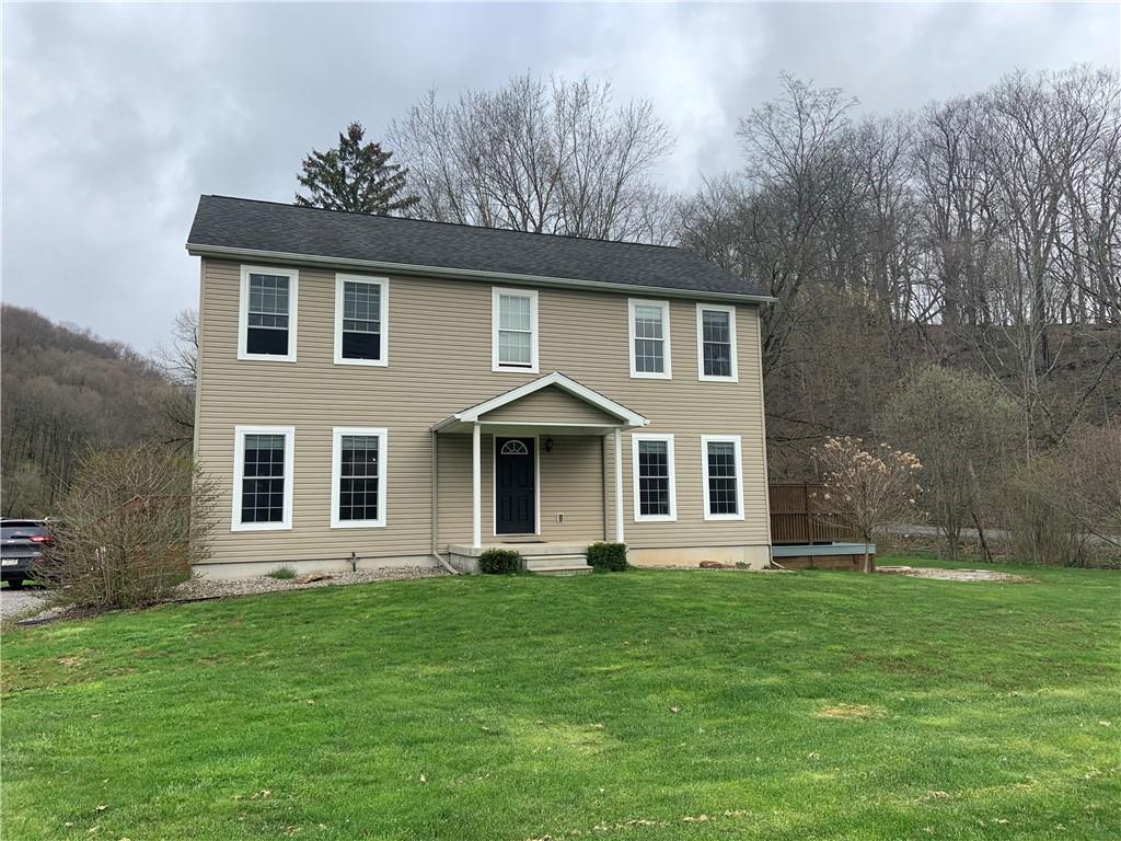 1217 Sarver Road Sarver, PA 16055 - Photo 1 of 23 a front view of a house with a garden