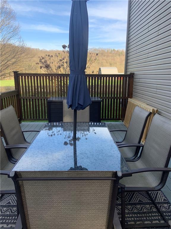 1217 Sarver Road Sarver, PA 16055 - Photo 19 of 23 a outdoor sitting area with furniture and wooden floor