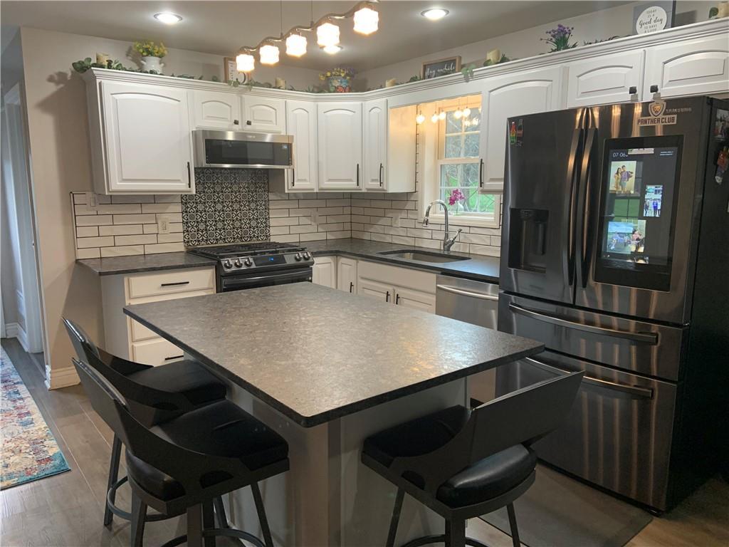 1217 Sarver Road Sarver, PA 16055 - Photo 3 of 23 a kitchen with a refrigerator and a sink