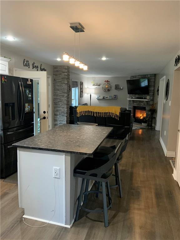 1217 Sarver Road Sarver, PA 16055 - Photo 6 of 23 a kitchen with stainless steel appliances granite countertop a table chairs and a refrigerator