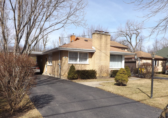 1020 Shermer Road Northbrook, IL 60062 - Photo 1 of 1 a front view of a house with a yard