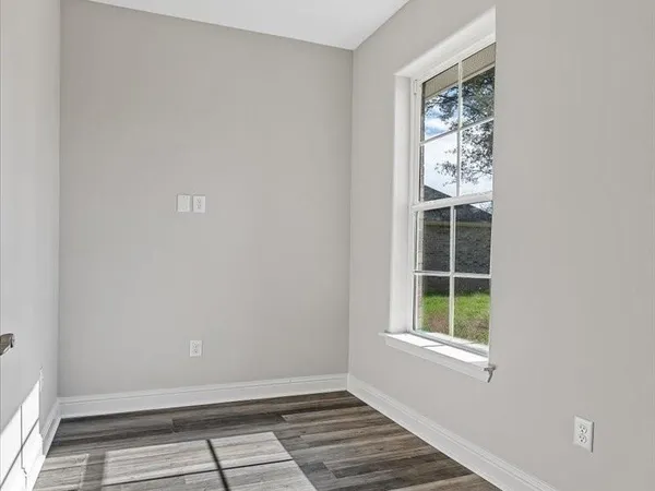 an empty room with windows