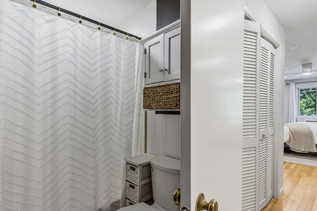 10 Erick Road, Unit 42 Mansfield, MA 02048 - Photo 26 of 33 a bathroom with a shower curtain and a window