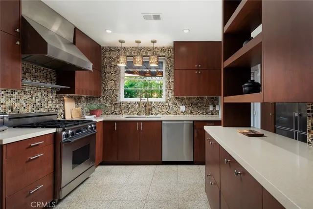 a kitchen with a sink stove and microwave