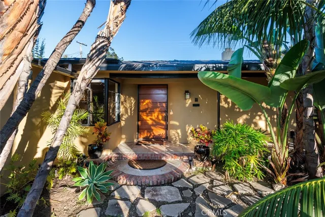 a front view of house with yard and seating area