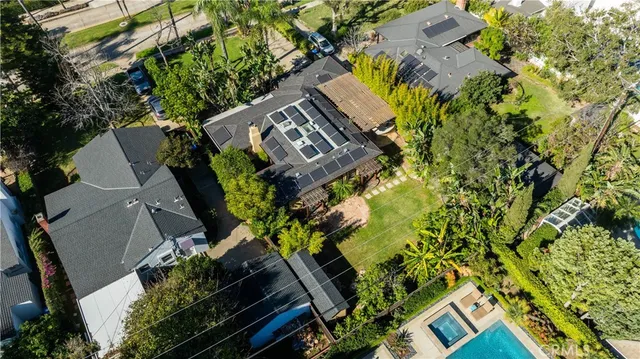 an aerial view of a house with a yard and outdoor space