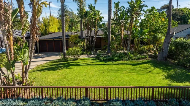 a view of a chair and table and chairs under an umbrella