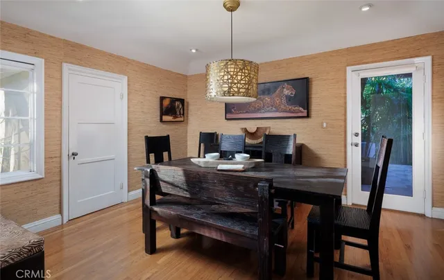 a view of a dining room with furniture window and wooden floor