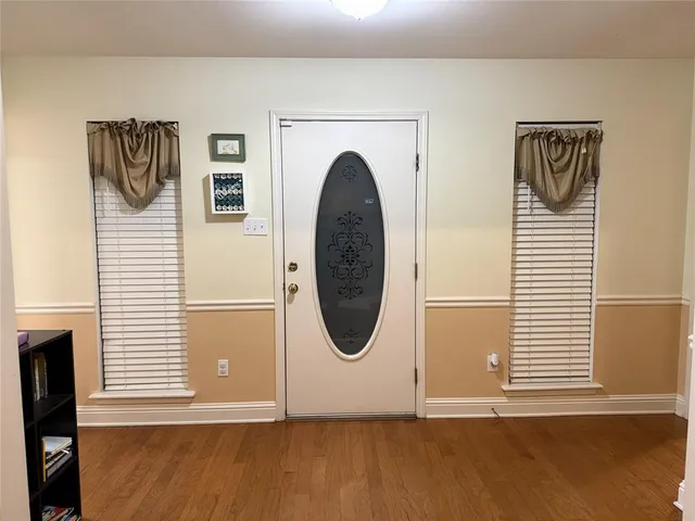 a view of a door with wooden floor