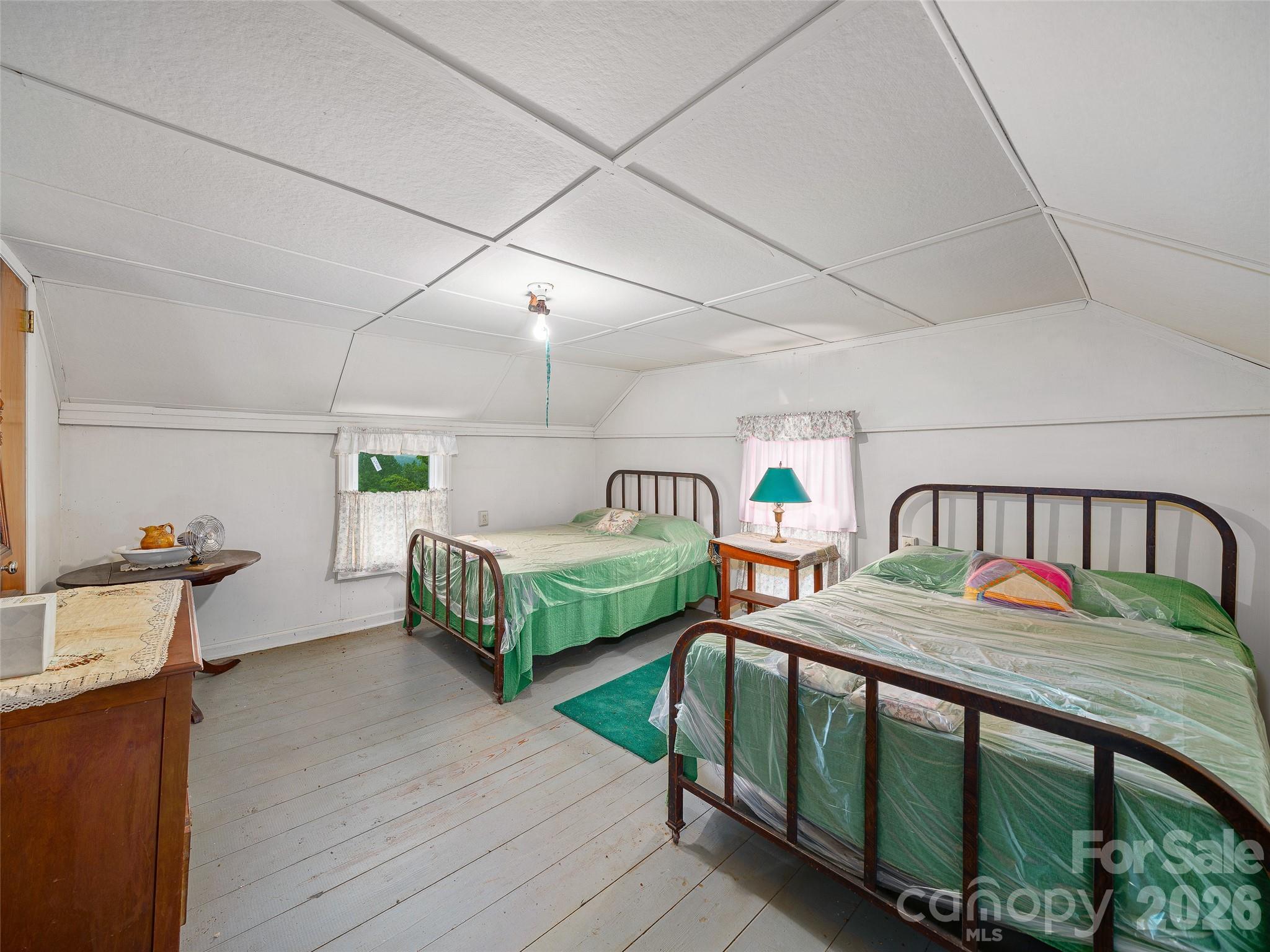 2380 Old Fort Road Black Mountain, NC 28711 - Photo 13 of 27 a bedroom with two beds and a dresser