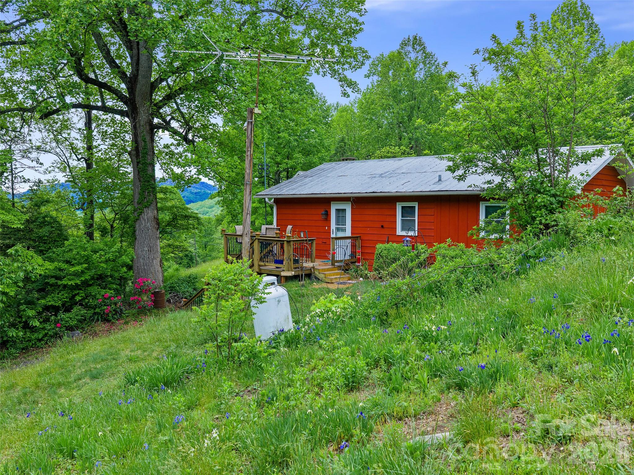 2380 Old Fort Road Black Mountain, NC 28711 - Photo 16 of 27 a front view of a house with garden