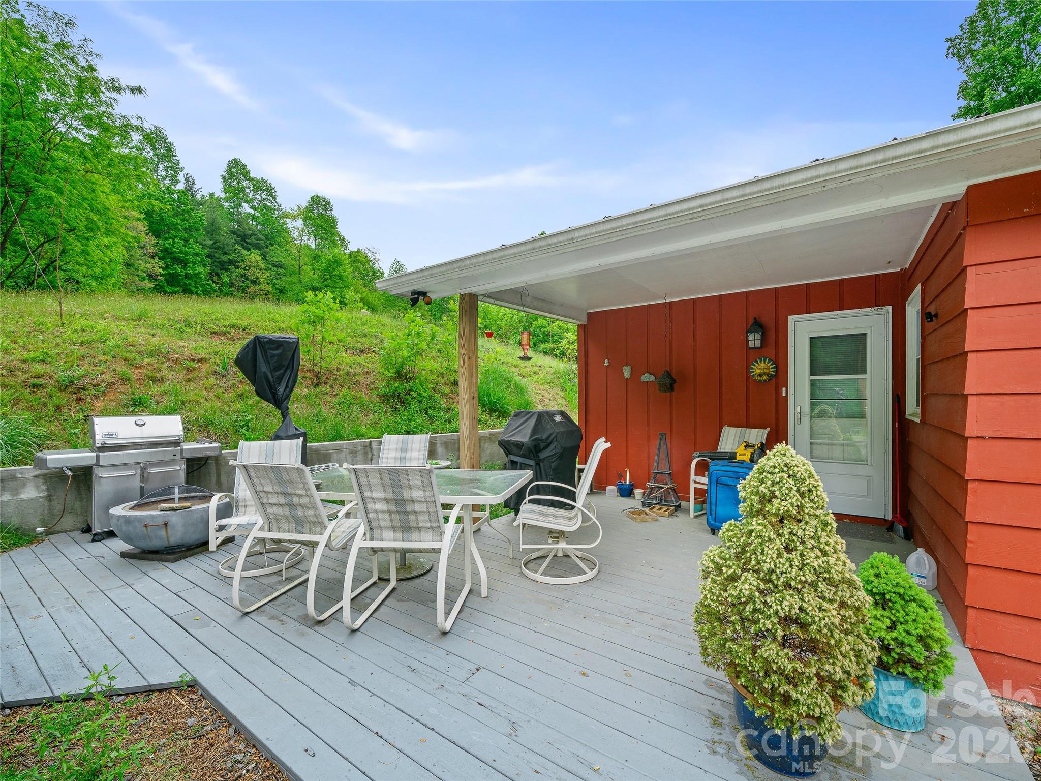 2380 Old Fort Road Black Mountain, NC 28711 - Photo 17 of 27 a view of a chairs and table in patio with wooden fence