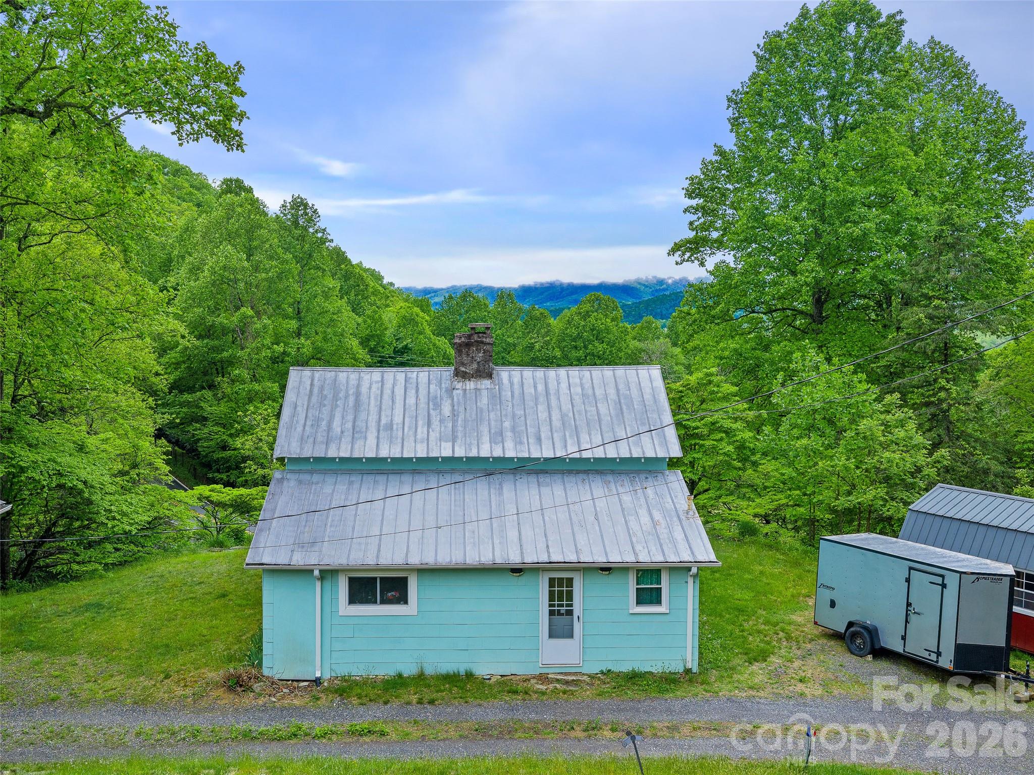 2380 Old Fort Road Black Mountain, NC 28711 - Photo 2 of 27 a view of a small house in the middle of a big yard