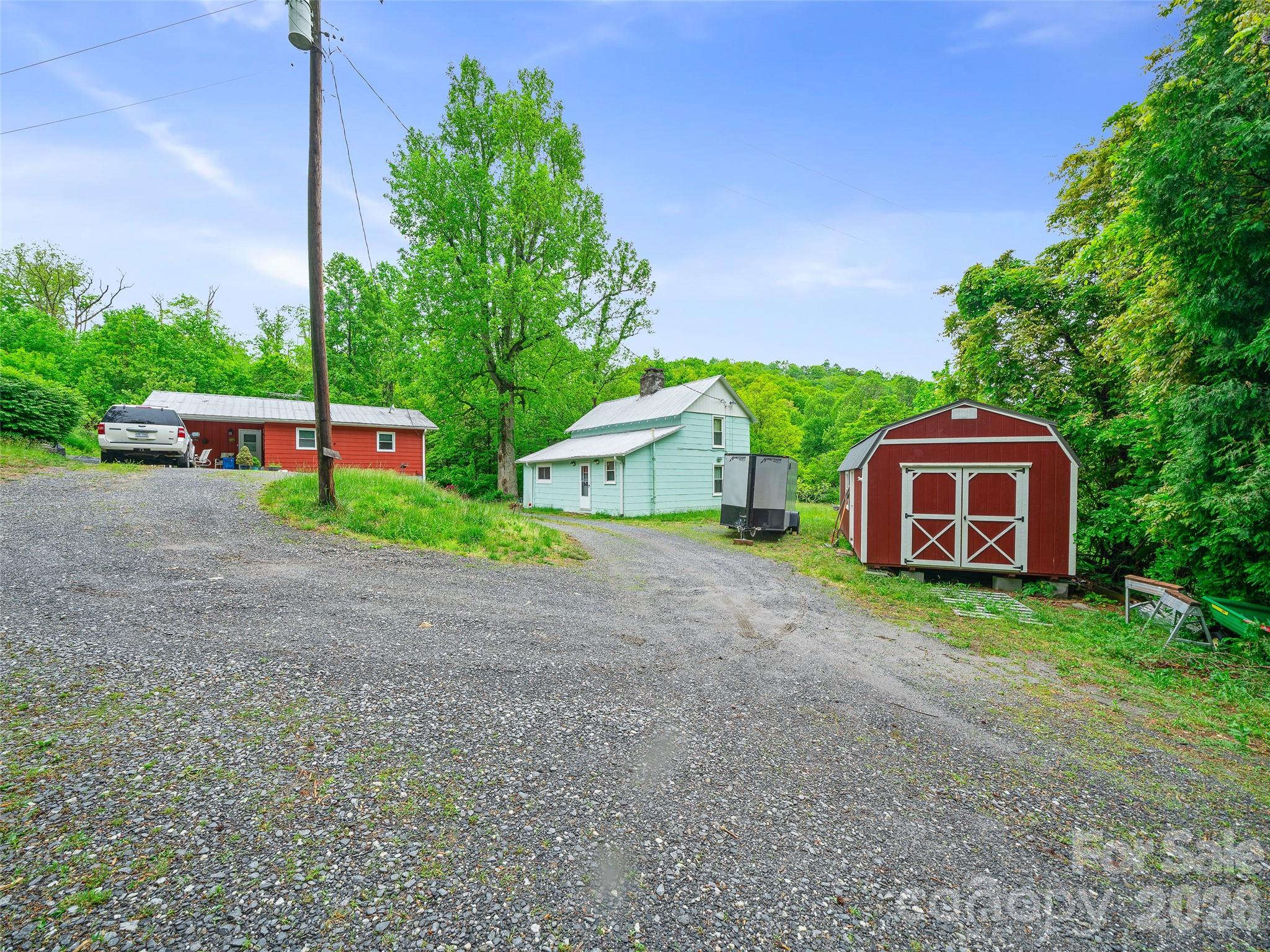 2380 Old Fort Road Black Mountain, NC 28711 - Photo 6 of 27 a house with trees in front of it