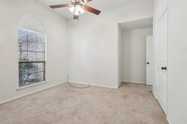 a kitchen with a refrigerator and a stove top oven