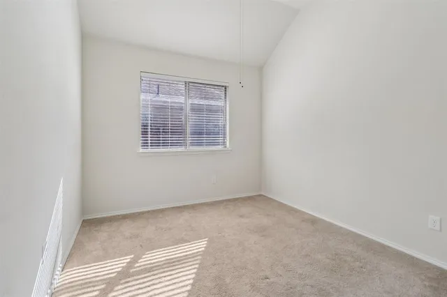 a bathroom with a sink a toilet and shower curtain