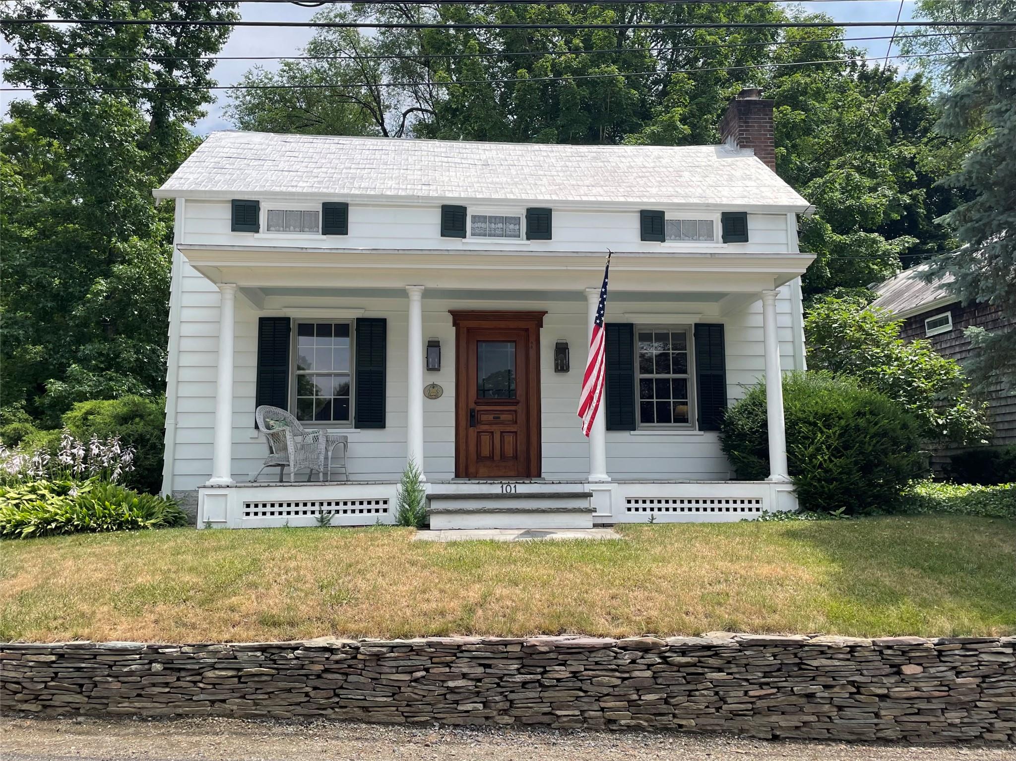 a view of a brick house with large windows