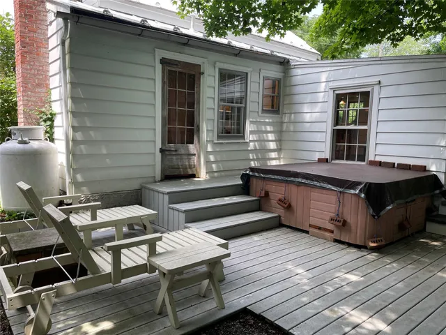 a view of a chairs and table in the back