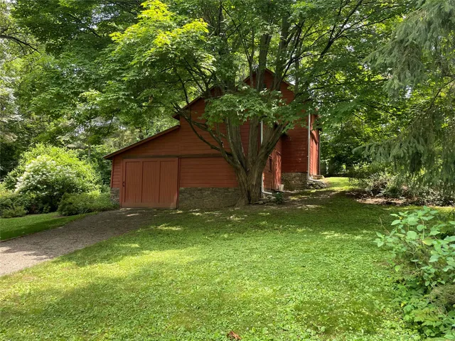 a backyard of a house with lots of green space