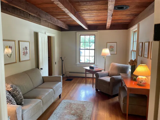 a living room with furniture and a lamp