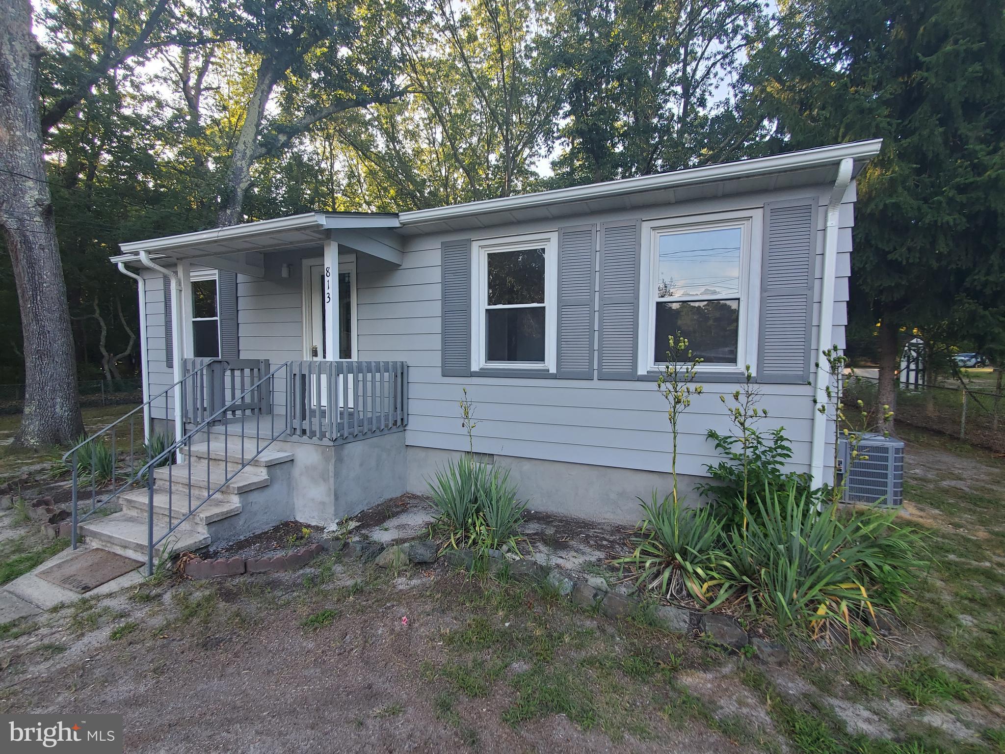 a backyard of a house with seating space