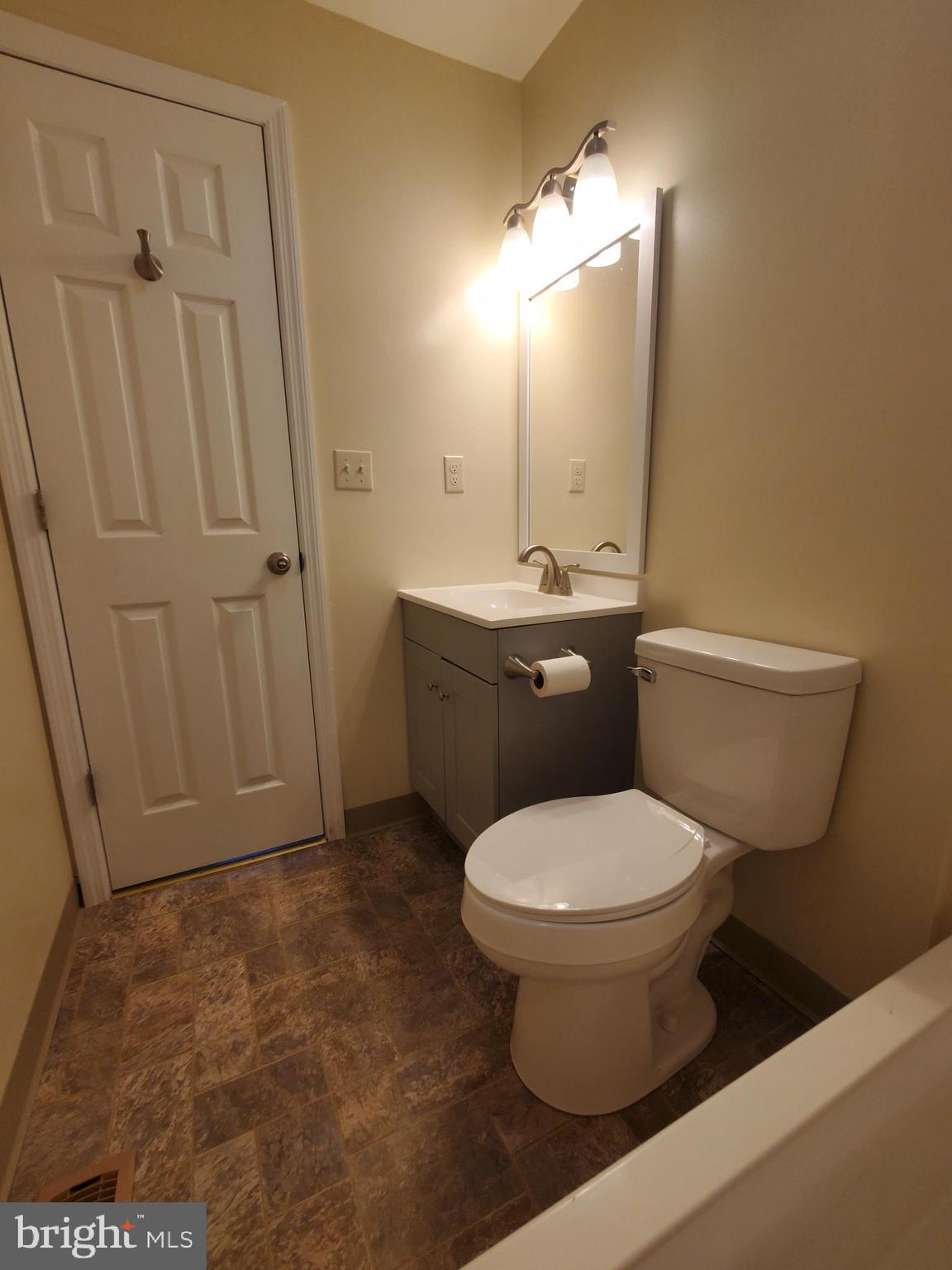 813 Hickory Avenue Browns Mills, NJ 08015 - Photo 11 of 13 a bathroom with a toilet a sink and mirror