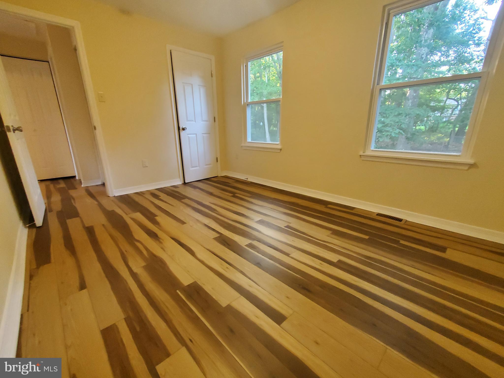 813 Hickory Avenue Browns Mills, NJ 08015 - Photo 9 of 13 a view of a room with wooden floor and windows