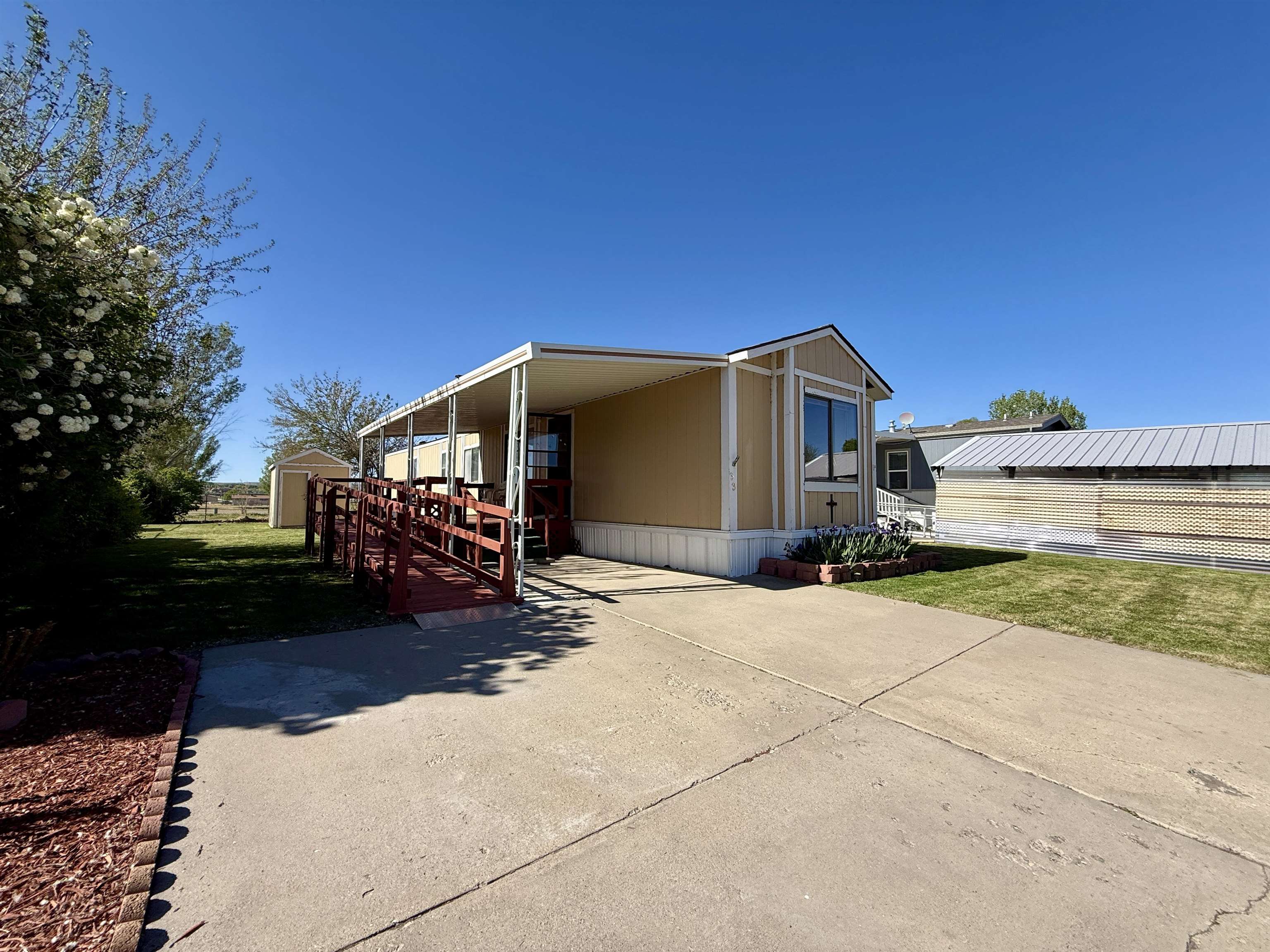 3251 E Road, Unit 33 Clifton, CO 81520 - Photo 3 of 28 a view of a house with a yard