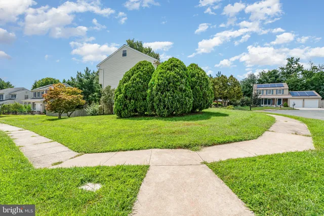 a view of a garden with an apartment