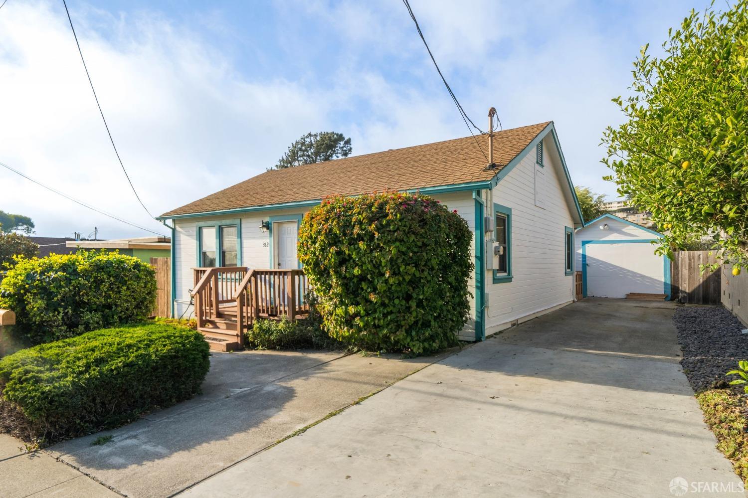 369 Brighton Road Pacifica, CA 94044 - Photo 1 of 21 a view of a house with potted plants
