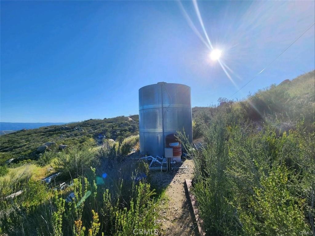 38125 Imler Road Hemet, CA 92544 - Photo 2 of 10 a view of a yard and an buildings in the background