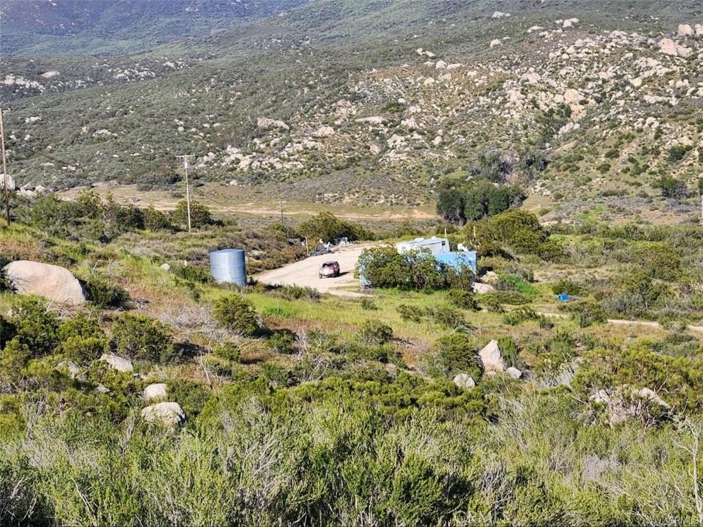 38125 Imler Road Hemet, CA 92544 - Photo 7 of 10 a view of a yard with plants and wooden fence