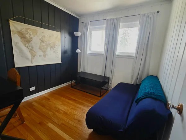 a bedroom with a bed and window