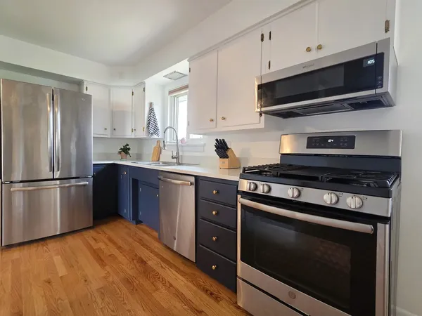 a kitchen with a stove microwave and refrigerator