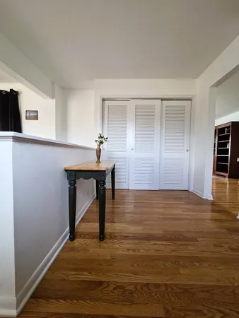 a view of room with window and wooden floor