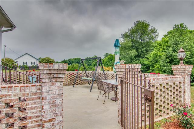 2364 Tom Fitzgerald Road Columbia, TN 38401 - Photo 18 of 20 Yes this is a brick latticed courtyard off the covered back porch. Storage shed remains. Gas line for a grill is plumbed in.